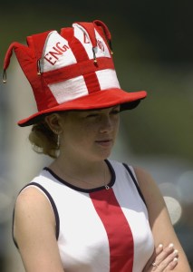 A racegoer in a patriotic hat watches the action of The Ribblesdale Stakes run at Ascot Racecourse in Ascot during the 3rd day of The Royal Meeting on June 20, 2002.