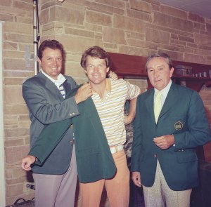 Tom Watson Puts On The Green Jacket With The Help Of Raymond Floyd As William Lane Watches At The Presentation Ceremony Of The 1977 Masters Tournament