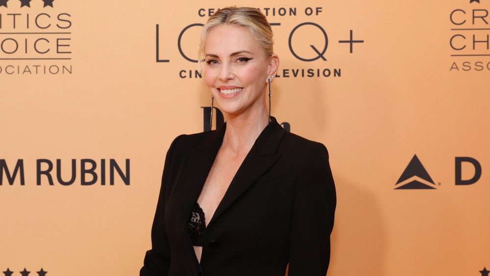 Charlize Theron peekaboo bra trend, black blazer peekaboo bra, Charlize Theron at the 2024 Critics Choice Association's inaugural Celebration of LGBTQ Cinema & Television on June 7.