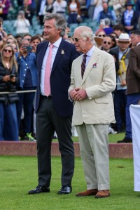 EGHAM, ENGLAND - JUNE 16: Laurent Feniou and King Charles III attend the Cartier Queen's Cup Polo at Guards Polo Club on June 16, 2024 in Egham, England. (Photo by Dave Benett/Getty Images for Cartier)