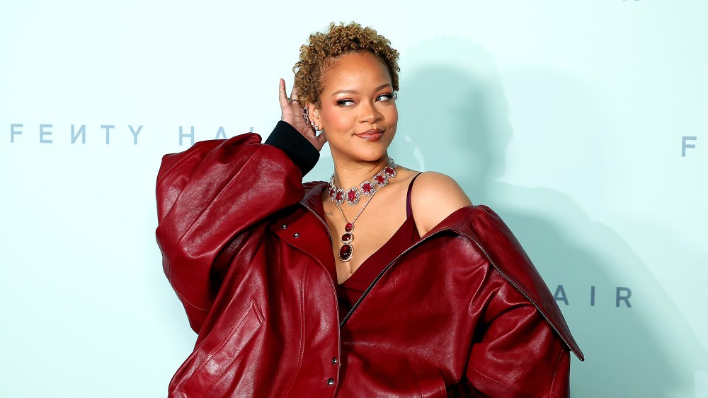 Rihanna natural hair style, attends the Fenty Hair launch party on June 10 in Los Angeles, curly cropped hair, red leather outfit
