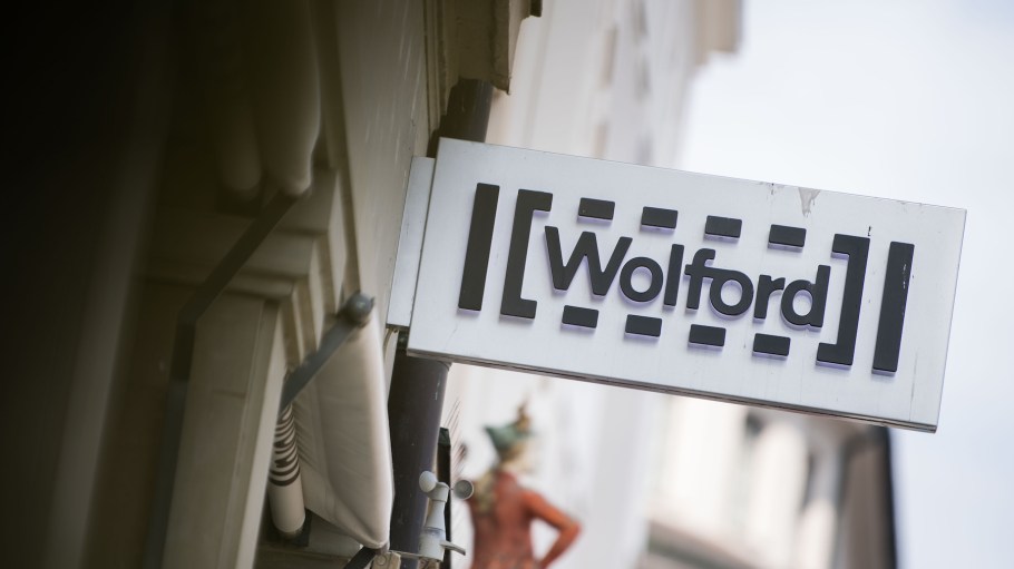 The logo of the stocking manufacturer Wolford hanging above the shop in a shopping street.