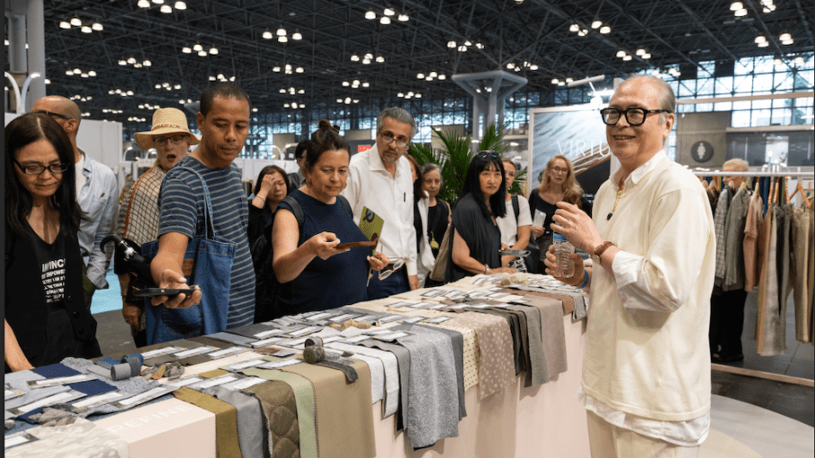 Kai Chow of Doneger|Tobe takes attendees on an Explore the Floor Tour of the Texworld Trend Showcase, produced by Messe Frankfurt.