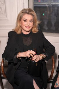 Catherine Deneuve at the AMI Spring 2025 ready-to-wear show