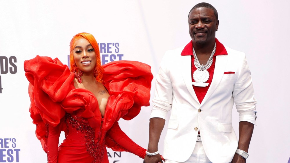 US-Senegalese singer Akon and his wife Tomeka "Amirror" Thiam arrive for the 2024 BET Awards at the Peacock theatre in Los Angeles, June 30, 2024. (Photo by Michael TRAN / AFP) (Photo by MICHAEL TRAN/AFP via Getty Images)