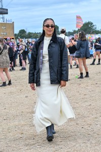 GLASTONBURY, ENGLAND - JUNE 28: Grace Carter is seen on day one of the Glastonbury Festival wearing Iconic British heritage brand Barbour on June 28, 2024 in Glastonbury, England. (Photo by Jed Cullen/Dave Benett/Getty Images)