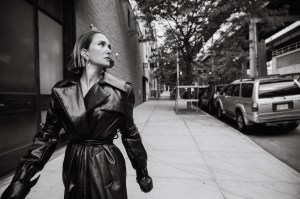 Alexander McQueen leather padded trench coat. Tory Burch logo spiked front-back earrings.