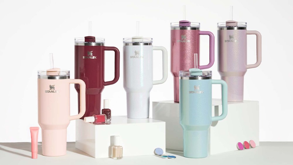 various tumbler cups beside beauty products