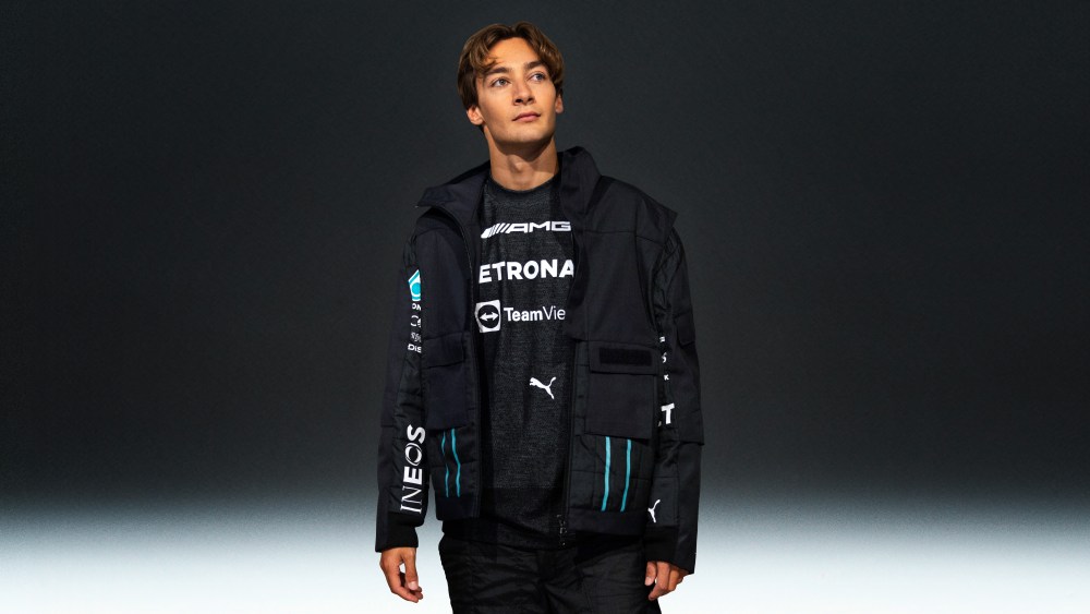 Mercedes F1 driver, George Russell wearing a look from the Mercedes-AMG Petronas F1 Team x Puma x Raeburn collection