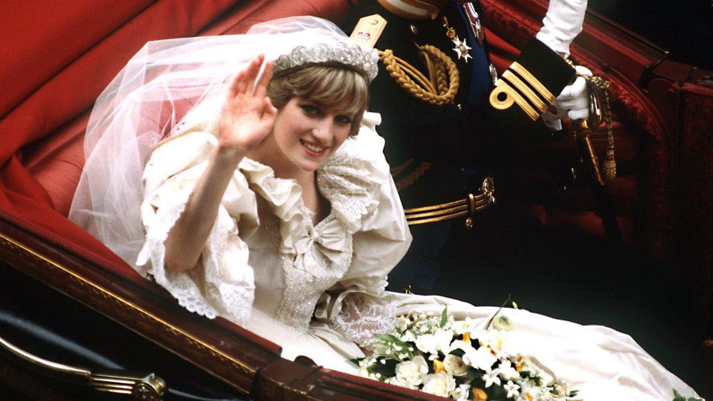 The Prince and Princess of Wales return to Buckingham Palace by carriage after their wedding, royals, bridal, wedding dress