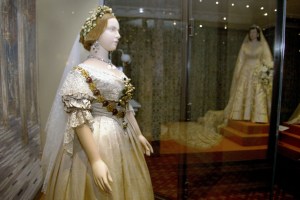 A mannequin of Britain's Queen Victoria, wearing her wedding dress, stands in front of a model of Queen Elizabeth (R) April 30, 2002 at the launch of the exhibition "A Century of Queens'' Wedding Dresses 1840 - 1947" at Kensington Palace in London. The dresses are on display for the first time as part of the Queen's Golden Jubilee celebrations. Queen Victoria married Prince Albert in 1840. The dress was made by one of the Queens dressmakers, Mrs Bettans from silk trimmed with lace.