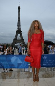 US tennis player Serena Williams arrives ahead of the opening ceremony of the Paris 2024 Olympic Games in Paris on July 26, 2024, as the Eiffel Tower is seen in the background. (Photo by Jonathan NACKSTRAND / AFP) (Photo by JONATHAN NACKSTRAND/AFP via Getty Images)