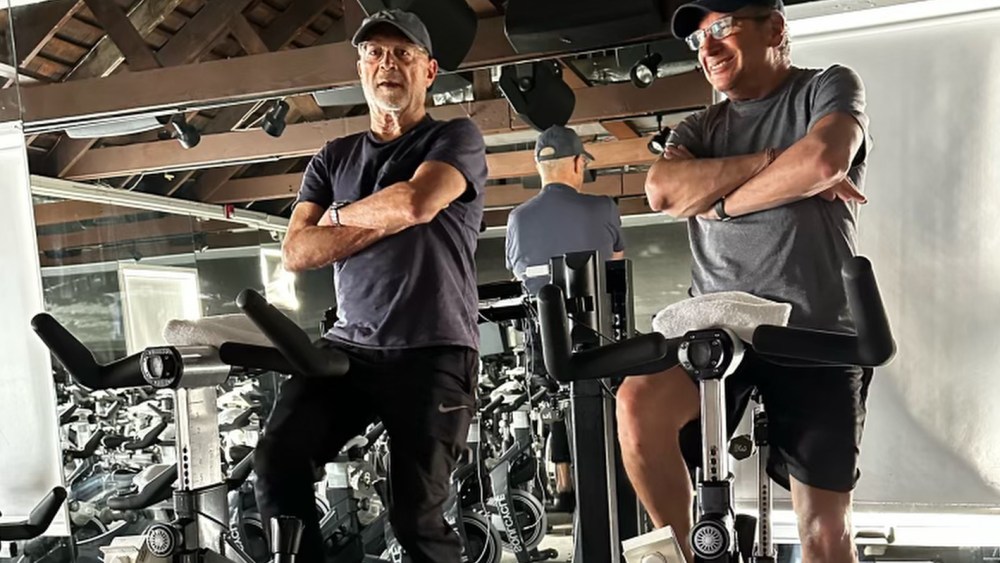 Mickey Drexler (left) and his friend Neal on the podium at SoulCycle