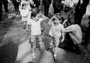 13th May 1965:  John F. Kennedy Jr. (1960 - 1999) (right), the son of Jackie Kennedy and the late American president walking in Green Park, London with his cousins Anthony and Tina (behind), the children of Jackie's sister Lee Radziwill.