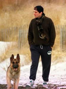 John F. Kennedy Jr. (1960 - 1999) looks out to sea while walking with his dog along the beach in Hyannis Port, Massachusetts, the day after his grandmother Rose Kennedy's death, 1/24/95.