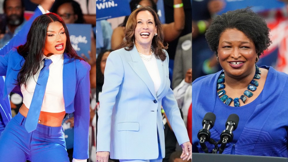 (L-R) Megan Thee Stallion, Kamala Harris and Stacey Abrams, all dressed in blue, at a campaign rally for Democratic presidential candidate, U.S. Vice President Kamala Harris at the Georgia State Convocation Center on July 30 in Atlanta, blue suit