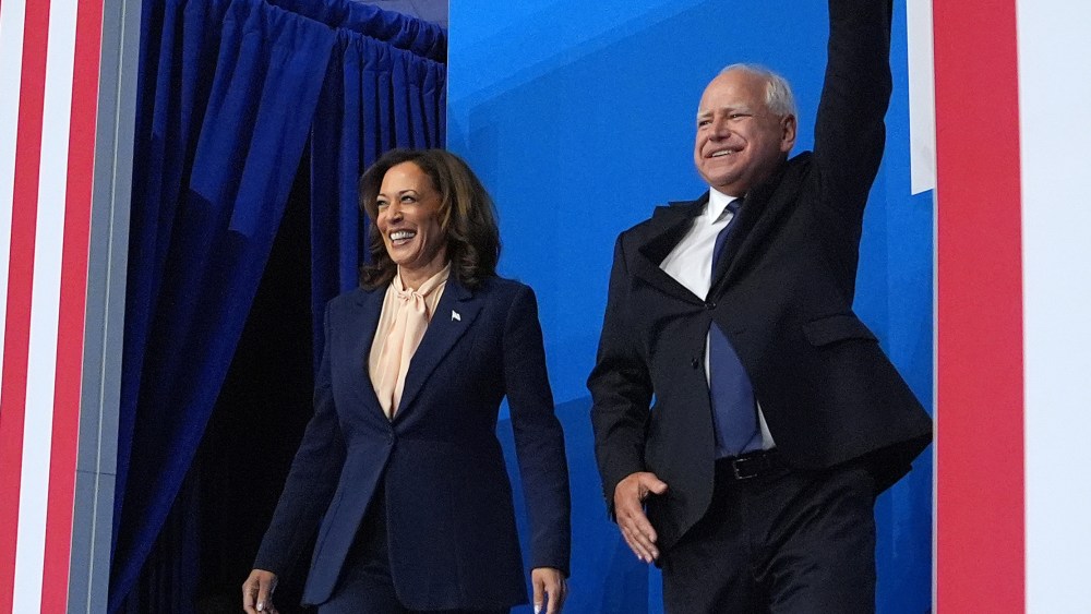 PHILADELPHIA, PENNSYLVANIA - AUGUST 6: Democratic presidential candidate, U.S. Vice President Kamala Harris and Democratic vice presidential candidate Minnesota Gov. Tim Walz appear on stage together during a campaign event at Girard College on August 6, 2024 in Philadelphia, Pennsylvania. Harris ended weeks of speculation about who her running mate would be, selecting the 60 year old midwestern governor over other candidates. (Photo by Andrew Harnik/Getty Images), blue suit