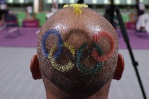 Undralbat Lkhagva, coach of Team Mongolia, has the Olympic rings on the back of his head during the 10m Air Pistol Women's event on day two of the Tokyo 2020 Olympic Games at Asaka Shooting Range on July 25, 2021 in Asaka, Saitama, Japan.