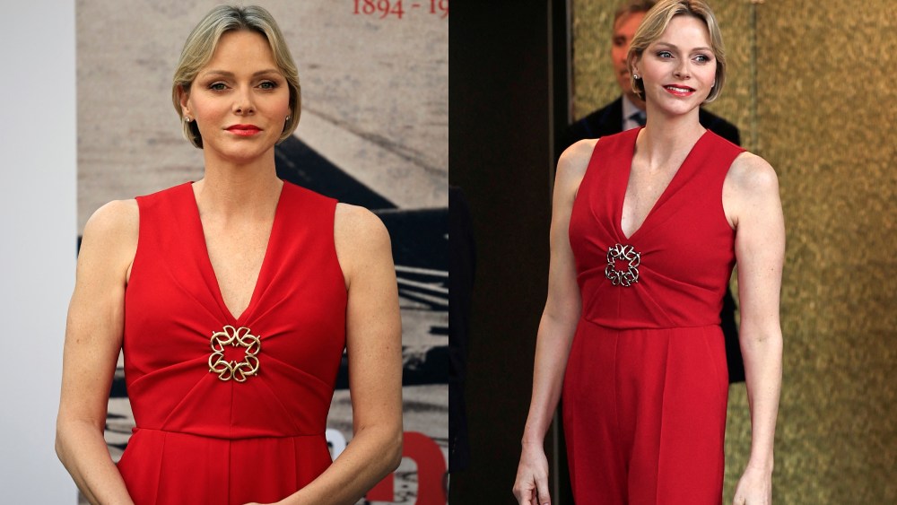 Princess Charlene of Monaco wears red elie saab jumpsuit arrives to attend the exibition "La flamme Olympique au fil des temps" on July 18, 2024 in Monaco. The exibition of 40 Olympic torchs of Prince's Albert II private collection takes place July 18 to August 18, 2024 in Monaco. (Photo by Valery HACHE / AFP) / NO TABLOID (Photo by VALERY HACHE/AFP via Getty Images)