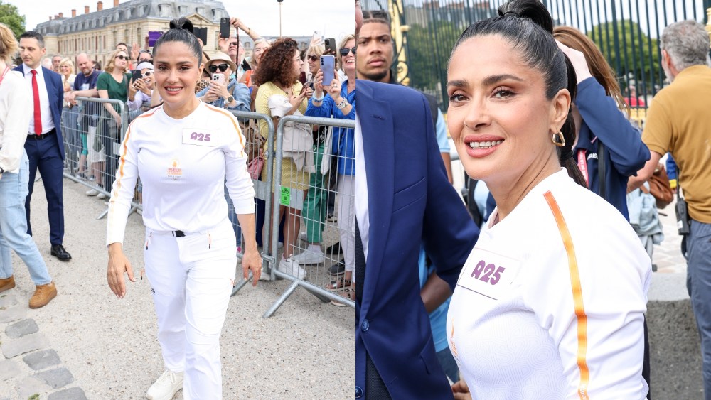 VERSAILLES, FRANCE - JULY 23: Salma Hayek runs during the Paris Olympics torch relay on July 23, 2024 in Versailles, France. Paris will host the Summer Olympics from July 26 to August 11, 2024. (Photo by Lyvans Boolaky/Getty Images)