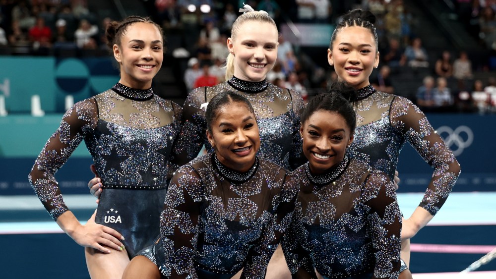 Hezly Rivera, Jade Carey, Sunisa Lee, Jordan Chiles and Simone Biles of Team USA pose for a photo during the women's artistic gymnastics qualification event on Day Two of the Paris Olympics 2024 on Sunday, team usa womens gymnastics uniform leotard outfit