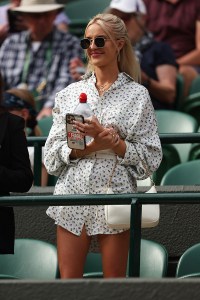 LONDON, ENGLAND - JULY 04: Morgan Riddle, partner of Taylor Fritz of The United States watches them play against Jason Kubler of Australia during their Men's Singles Fourth Round match on day eight of The Championships Wimbledon 2022 at All England Lawn Tennis and Croquet Club on July 04, 2022 in London, England. (Photo by Julian Finney/Getty Images)