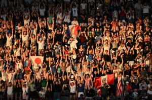 Spectators do the Mexican wave prior to the start of the closing ceremony of the Paris 2024 Olympic Games at the Stade de France, in Saint-Denis, in the outskirts of Paris, on August 11, 2024.