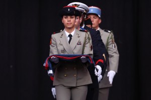 France's national flag enters the stadium carried by members of several corps of the French Army during the closing ceremony of the Paris 2024 Olympic Games at the Stade de France, in Saint-Denis, in the outskirts of Paris, on August 11, 2024.