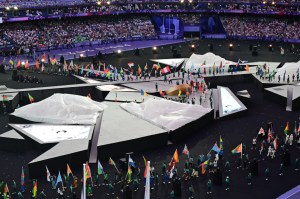 Flag bearers enter the Stade de France during the closing ceremony in Paris.