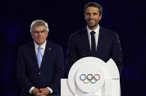 President of the Paris 2024 Olympics and Paralympics Organising Committee (Cojo) Tony Estanguet (C), International Olympic Committe (IOC) President Thomas Bach (L), delivers a speech during the closing ceremony of the Paris 2024 Olympic Games at the Stade de France, in Saint-Denis, in the outskirts of Paris, on August 11, 2024.