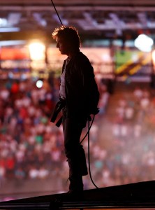 US actor Tom Cruise stands on the roof of the Stade de France during the closing ceremony of the Paris 2024 Olympic Games at the Stade de France, in Saint-Denis, in the outskirts of Paris, on August 11, 2024.