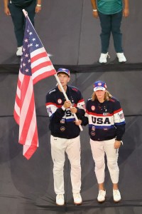 Flagbearers Nick Mead and Katie Ledecky of Team United States of America hold their nation's flag during the Closing Ceremony of the Olympic Games Paris 2024 at Stade de France on August 11, 2024 in Paris, France.