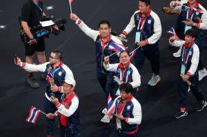 Athletes of Team Thailand wave their nation's flag during the Closing Ceremony of the Olympic Games Paris 2024 at Stade de France on August 11, 2024 in Paris, France.
