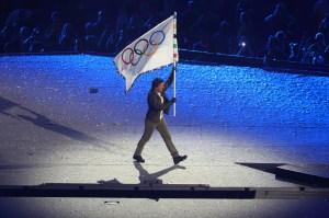 American Actor and Film Producer Tom Cruise carries the Olympic flag during the Closing Ceremony of the Olympic Games Paris 2024 at Stade de France on August 11, 2024 in Paris, France.