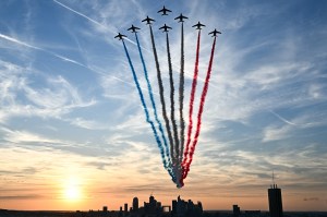 TOPSHOT - This photograph taken from the Arc de Triomphe shows French Air Force Elite acrobatic flying team "Patrouille de France" performing over la Defense during the Paris 2024 Paralympic Games Opening Ceremony in Paris on August 28, 2024.