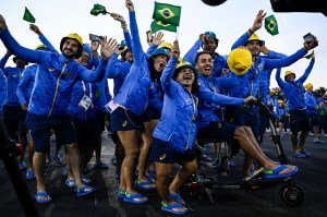 Brazil's delegation arrives during the Parade of Nations as part of the Paris 2024 Paralympic Games Opening Ceremony at the Place de la Concorde with the Eiffel Tower in the back in Paris on August 28, 2024.