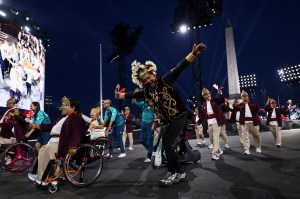 Indonesia's delegation parades at the Place de la Concorde with the Obelisque de Louxor (Luxor Obelisk) in the background during the Paris 2024 Paralympic Games Opening Ceremony in Paris on August 28, 2024.
