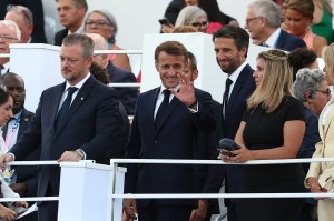 France's President Emmanuel Macron (C) waves, flanked by French President of the Paris 2024 Olympics and Paralympics Organising Committee (COJO) Tony Estanguet (3rdR) and President of the International Paralympic Committee (IPC Andrew Parsons (L) at the Place de la Concorde ahead of the start of the Paris 2024 Paralympic Games Opening Ceremony in Paris on August 28, 2024.