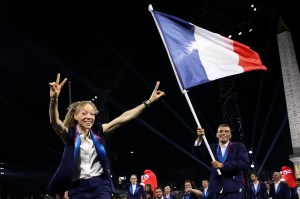 TOPSHOT - France's paralympic flag bearer Nantenin Keita (L) and France's paralympic flag bearer Alexis Hanquinquant (R) parade at the Place de la Concorde during the Paris 2024 Paralympic Games Opening Ceremony in Paris on August 28, 2024.