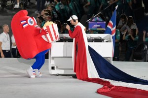 French DJ MYD reacts with the Paralympic mascot the Phryge at the Place de la Concorde during the Paris 2024 Paralympic Games Opening Ceremony in Paris on August 28, 2024.