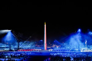 This photograph shows the Obelisque de Louxor (Luxor Obelisk) illuminated in the colours of the French flag at the Place de la Concorde during the Paris 2024 Paralympic Games Opening Ceremony in Paris on August 28, 2024.
