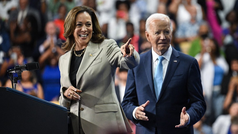 Vice President Kamala Harris and President Joe Biden at a campaign rally in Largo, Maryland on Aug. 15, taupe suit, gold chain necklace