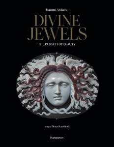 The cover of the book features a large agate cameo of Medusa by master engraver Benedetto Pistrucci, made in England in 1844.This photograph was taken in September 2022 in Doha, Qatar with the permission and cooperation of Qatar Museums