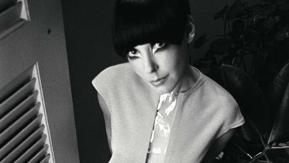 Model Peggy Moffitt wearing a short dress with clear plastic center panel from the spring/summer ’68 collection by Rudi Gernreich.