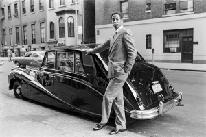 André Leon Talley poses in front of a luxury car in New York, 1979.