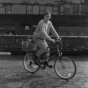 Designer Christian Francis Roth and his dog on a bicycle on the rooftop of his design studio on April 25, 1990 in New York.