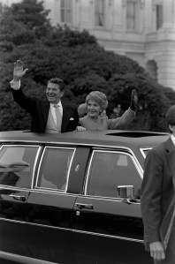 Ronald Reagan and Nancy Reagan wave to onlookers during the 1981 presidential inauguration motorcade in Washington D.C., on January 20, 1981.