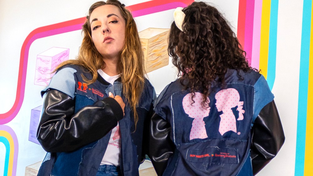 Eco-adaptive varsity jacket worn on disability model Jessica Ping