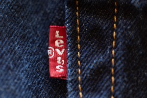 CHICAGO, ILLINOIS - JANUARY 29: In this photo illustration, a tag featuring the company logo is attached to a pair Levi's jeans on January 29, 2024 in Chicago, Illinois. Levi Strauss said it will lay off at least 10 percent of its corporate workforce during the first half of 2024 as part of a restructuring plan. (Photo Illustration by Scott Olson/Getty Images)