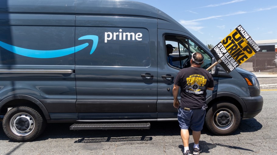 A member of Teamsters Local Union No. 396 talks to an Amazon truck driver he knows at the labor strike at DAX7 Amazon Sortation Center in Palmdale, Calid., Aug. 4, 2024.